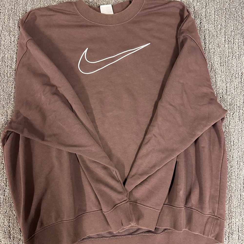 Nike women’s Crewneck Sweater in a purple color with White Logo